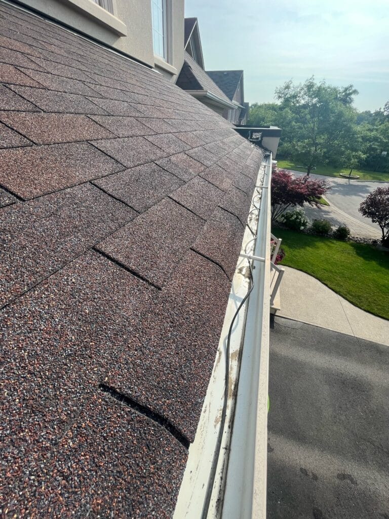 C&N Window Cleaning crew performing gutter cleaning on a Durham Region residential property